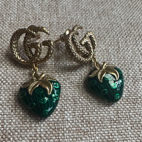 Gucci Jewelry - Gucci Gold Double G Drop Earrings with Green Strawberry Charms